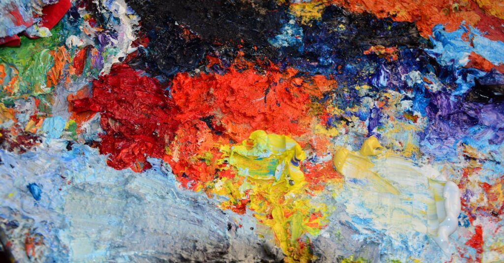 Close-up of a colorful oil paint palette showcasing vibrant textures and hues.