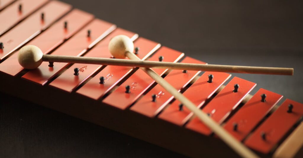 Detailed image of a red xylophone with wooden mallets, emphasizing musical texture.