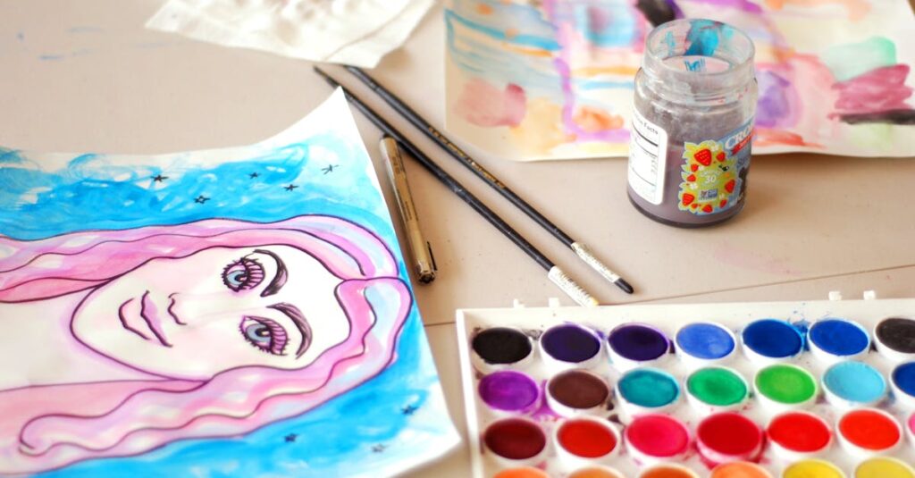 Colorful watercolor artwork with paint set, brushes, and paper in a creative studio setting.