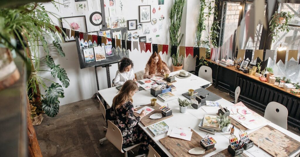 Women engaging in an artistic workshop, surrounded by art supplies and creative decor.