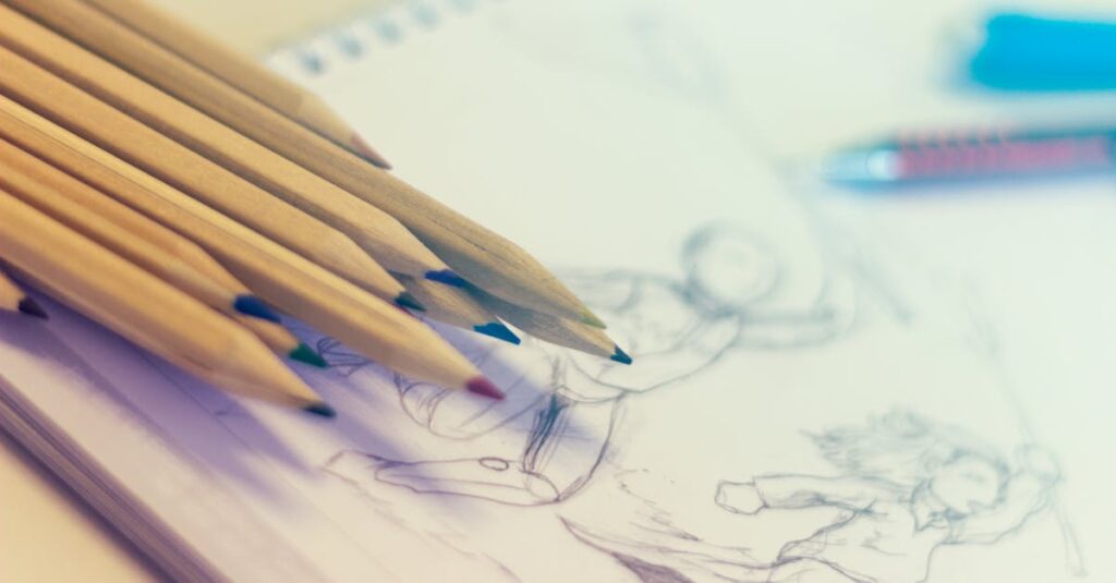 Close-up of colored pencils on sketch-filled notepad, perfect for creativity concepts.